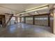 Spacious garage with two doors, work area, and ample lighting at 5195 Allison St, Arvada, CO 80002