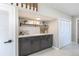 Hallway with built-in cabinets, shelving, and a closet offering ample storage space at 5195 Allison St, Arvada, CO 80002