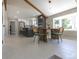 Open-concept kitchen with stainless steel appliances, bar seating, and an adjacent dining area at 5195 Allison St, Arvada, CO 80002