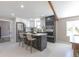 Modern kitchen with stainless steel appliances, a center island with bar stools, and stylish cabinetry at 5195 Allison St, Arvada, CO 80002