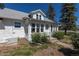 Sunroom with multiple windows, white trim, and black iron railing at 5195 Allison St, Arvada, CO 80002