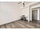 Cozy bedroom featuring a ceiling fan, desk, and built-in closet at 18657 Stroh Rd # 4103, Parker, CO 80134