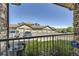 View of the building's garages, parking, and greenery from a home's patio at 18657 Stroh Rd # 4103, Parker, CO 80134