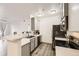 Modern kitchen with stainless steel appliances, grey cabinets, and a breakfast bar at 18657 Stroh Rd # 4103, Parker, CO 80134