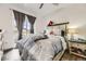 Comfortable main bedroom with a stylish bed, balcony access, and neutral decor at 18657 Stroh Rd # 4103, Parker, CO 80134
