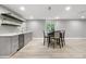 Finished basement bar with countertop, seating, and backsplash with wine storage at 9340 Mount Jackson St, Littleton, CO 80125