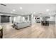Spacious finished basement with stylish seating area, kitchenette, and recreational spaces at 9340 Mount Jackson St, Littleton, CO 80125
