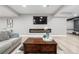 Cozy basement with decorative fireplace and large television. Great spot to relax at 9340 Mount Jackson St, Littleton, CO 80125