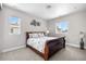 Cozy bedroom with warm colors and decor, features two windows allowing for natural light at 9340 Mount Jackson St, Littleton, CO 80125