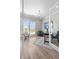 Bright home office with large windows offering scenic views, wood floors, and modern decor at 9340 Mount Jackson St, Littleton, CO 80125