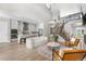 Elegant living room featuring an open layout, staircase, and seamless connection to the modern kitchen at 9340 Mount Jackson St, Littleton, CO 80125