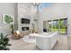 Inviting living room features a cozy fireplace, stylish furnishings, and seamless access to the outdoor patio at 9340 Mount Jackson St, Littleton, CO 80125