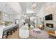 Bright, open-concept living room boasts high ceilings, fireplace, and staircase to the second floor at 9340 Mount Jackson St, Littleton, CO 80125