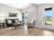 Bright living room featuring modern decor, wood floors, and a sun-soaked view of the outdoors at 9340 Mount Jackson St, Littleton, CO 80125