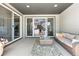 Cozy outdoor patio with sliding glass doors leading to the home's interior at 9340 Mount Jackson St, Littleton, CO 80125
