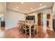 Dining area features hardwood floors and an open layout to the kitchen at 13987 Lexington Dr, Parker, CO 80134