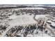 Aerial view of a residential neighborhood, showing houses and open space at 7260 Fallon Cir, Castle Rock, CO 80104