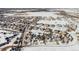 Aerial view of a residential neighborhood with houses covered in snow at 7260 Fallon Cir, Castle Rock, CO 80104