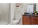 Clean bathroom with shower, toilet and granite countertop at 7260 Fallon Cir, Castle Rock, CO 80104