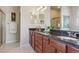 Bathroom with double vanity, granite countertops, and shower at 7260 Fallon Cir, Castle Rock, CO 80104