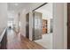 Hardwood floor hallway with access to multiple rooms at 7260 Fallon Cir, Castle Rock, CO 80104