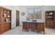 Bright home office with built-in shelving and large window at 7260 Fallon Cir, Castle Rock, CO 80104