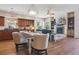 Open kitchen and dining area with hardwood floors and fireplace at 7260 Fallon Cir, Castle Rock, CO 80104