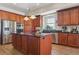 Island kitchen with stainless steel appliances and dark countertops at 7260 Fallon Cir, Castle Rock, CO 80104