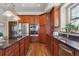 Large kitchen with stainless steel appliances and an island at 7260 Fallon Cir, Castle Rock, CO 80104