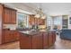 Eat-in kitchen with island, stainless steel appliances, and dark counters at 7260 Fallon Cir, Castle Rock, CO 80104
