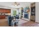 Relaxing living room with a fireplace, built-in shelving, and large windows at 7260 Fallon Cir, Castle Rock, CO 80104