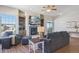 Living area with fireplace, built-ins, and access to balcony at 7260 Fallon Cir, Castle Rock, CO 80104