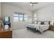Main bedroom with a king-size bed and large windows at 7260 Fallon Cir, Castle Rock, CO 80104