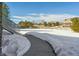 Concrete pathway leading through snowy yard at 7260 Fallon Cir, Castle Rock, CO 80104
