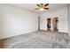Spacious bedroom features a ceiling fan, neutral carpet and a large walk-in closet at 795 S Alton Way # 5D, Denver, CO 80247