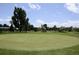 Well-maintained golf course with green lawns, mature trees, and a serene pond at 795 S Alton Way # 5D, Denver, CO 80247