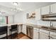 Open kitchen featuring granite countertops, stainless steel appliances, and eat-in bar at 795 S Alton Way # 5D, Denver, CO 80247