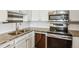 Updated kitchen features granite countertops, stainless steel appliances, and white subway tile backsplash at 795 S Alton Way # 5D, Denver, CO 80247