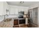 Kitchen with granite counters, wine fridge, and stainless steel appliances at 795 S Alton Way # 5D, Denver, CO 80247