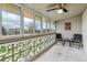 Enclosed patio with ample seating and a ceiling fan, offering a cozy outdoor space at 795 S Alton Way # 5D, Denver, CO 80247