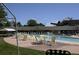 Community swimming pool area with tables and chairs providing an inviting outdoor space at 795 S Alton Way # 5D, Denver, CO 80247
