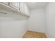 Spacious storage room with wall to wall cupboards, tiled flooring, and electrical outlets at 795 S Alton Way # 5D, Denver, CO 80247