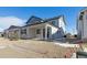 New construction home with covered patio and gravel backyard at 6575 N Nepal St, Aurora, CO 80019