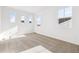 Well-lit bedroom with carpet flooring and multiple windows at 6575 N Nepal St, Aurora, CO 80019