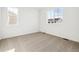 Spacious bedroom with neutral carpet and dual windows at 6575 N Nepal St, Aurora, CO 80019