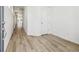 Bright and airy entryway with light wood-look flooring at 6575 N Nepal St, Aurora, CO 80019