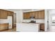 Open concept kitchen with an island and modern appliances at 6575 N Nepal St, Aurora, CO 80019