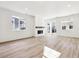 Open concept living room with hardwood floors and sliding glass doors at 6575 N Nepal St, Aurora, CO 80019