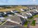 Aerial view of a neighborhood with well-maintained houses, lawns, and streetscapes at 8890 S Quatar Ct, Aurora, CO 80016