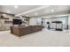 Spacious finished basement with large sofa and workout area at 8890 S Quatar Ct, Aurora, CO 80016